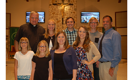 Father Michael Matveenko, pastor of Charles Borromeo Parish, Sicklerville, with Kathy (next to Father Michael) and Sean Ryan (far right), and their six children, who are, back row, Patrick and Matthew; and front row, Megan, Madison, Brittney and Kaitlyn.

Photo by James A. McBride