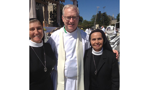 Father Vince Guest, pastor of Holy Cross Parish, Bridgeton, is pictured with Sister Maria de Jesus and Sister Graciela at The Catholic University of America for the papal Mass and canonization of St. Junipero Serra. When leaving the United States, Pope Francis called American nuns “great, great, great women.”