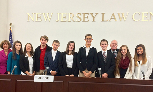 Pictured are the Holy Spirit High School defense team and coaches. From left, Mary Beth Clark, attorney coach, Law Firm of Levine, Staller, Sklar, Chan & Brown; students Kara O’Brien, Courtney Randik, Jack Bannan, Chris Gross, Nicole Wenzel, Olivia Torres and Steven Grimmie; David Pfeifer, faculty advisor; and students: Maggie Gibbons and Cierra Grabill.