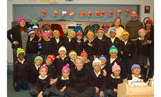 Roslyn Rothenberg (seated, first row) of Haddon Heights knit 23 hats for the first grade class of St. Anthony of Padua School, Camden, as well as the principal and teachers. “It was a lot of fun to do the knitting,” she said. “Giving them to the children and seeing their joy is on my life list of best things ever.”

Photo by James A. McBride
