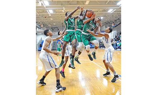 On Jan. 21, the Paul VI Eagles defeated the visiting Camden Catholic Irish in Haddon Township, by a score of 51-38. Above, the Irish’s Chris Okafor, Jamal Parker and Terrance Harris jump as a team for control of the ball.

Photo by Alan M. Dumoff, more photos http://ccdphotolibrary.smugmug.com
