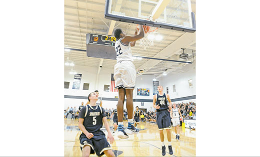In high school boys’ basketball action, Saint Augustine defeated visiting Holy Spirit (Absecon) in Richland by a score of 71-46. In photo, the Hermits’ Justyn Mutts dunks in 2 points for Saint Augustine.

Photo by Alan M. Dumoff, more photos ccdphotolibrary.smugmug.com