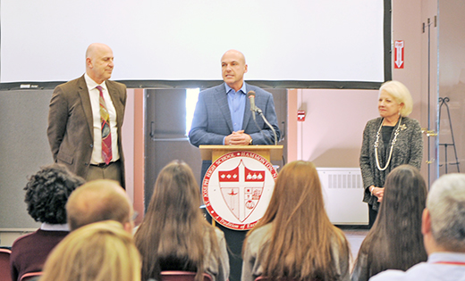 Jeff Umosella talks to students and faculty of Saint Joseph High School, Hammonton, on March 21 of his pledge of $1 million over four years to the school. Looking on are Paul Ordille of the Board of Trustees and Lynn Domenico, principal.

Photo by Alan M. Dumoff