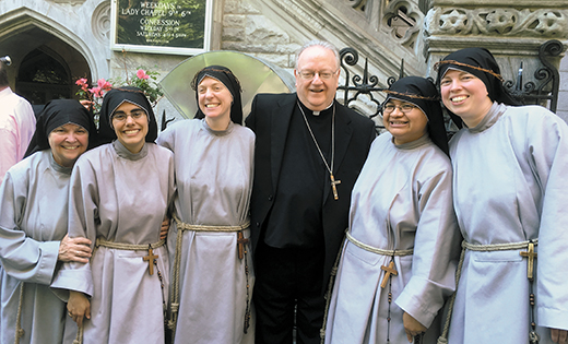 Bishop Dennis Sullivan received the perpetual vows of four Franciscan Sisters of the Renewal on June 6. He is pictured with the four and the Servant Leader of the community, Mother Lucille, after the Mass.