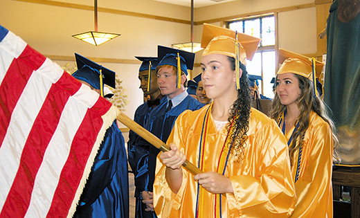 Tarryn Slattery leads her fellow classmates of Holy Spirit High School, Absecon, into the Church of the Assumption, Parish of Our Lady of Perpetual Help, Galloway, for baccalaureate Mass and commencement exercises on June 5. Nearly 800 students graduated from the Camden Diocese’s six high schools.

Photo by James A. McBride