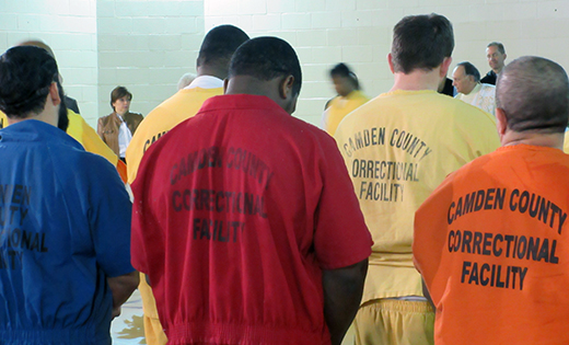 Men pray during a Mass with Bishop Dennis Sullivan at the Camden County Correctional Facility.

Photo by Joanna Gardner
