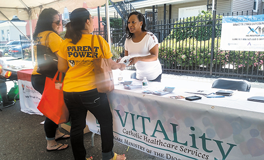 On June 10, representatives from VITALty Catholic Healthcare Services attended the Hispanic Family Center of New Jersey’s Annual Community Health Fair and Concert at 29th and Federal streets in Camden. Mimi Schaible, director of Care Coordination and Consultation and Natasha Sauls, call center coordinator, provided literature in both Spanish and English about VITALity’s recently developed Resource and Referral Help Line and Care Coordination Programs. More than 300 individuals and families visited VITALity’s information table. Many talked about their loved ones, mostly seniors and persons with disabilities, who need help at home. Sauls, who is bilingual, answers the telephone for VITALity’s Resource and Referral Help Line and provides contact information for community and social services. She also arranges for VITALity’s Care coordinators, nurses and social workers to visit individuals in the home to connect them with medical and community services. Since the program began in December 2015, VITALity’s Help Line operators and care coordinators have helped connect over 300 seniors and persons with disabilities with home and community services. For more information about Vitality call 888-26-VITALity, 888-268-4825, or visit the website, vitality.camdendiocese.org