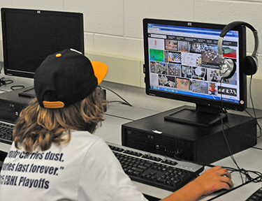 A student works at a computer during the summer enrichment program at Bishop McHugh Regional School, Cape May Court House. Like many schools in the Diocese of Camden, Bishop McHugh offered a program based on STREAM (science, technology, religion, engineering, the arts and mathematics).

Photo by Alan M. Dumoff