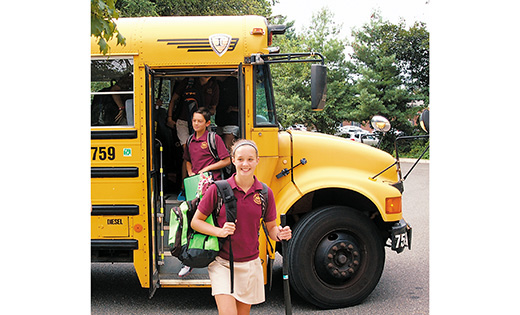 Christ the King Regional School student Mollie Crumpton walks off the bus Sept. 6 for the first day of the new year at the Haddonfield school. Behind her is Nick Sulpizio.

Photo by James A. McBride