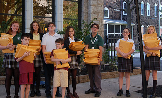 With their arms full of letters to be mailed to legislators are, in front, brothers Paul and Patrick McInerney from Christ the King School, Haddonfield, and in back Erin Wilson and Sarah Robbins of Camden Catholic High School, Cherry Hill; Josh Kolasa of Resurrection, Cherry Hill; Alessandra Kinney Farraro and Chris Stefanacci of Camden Catholic; and Grace Pierlott and Alexandra Senior of Resurrection.

Photo by James A. McBride