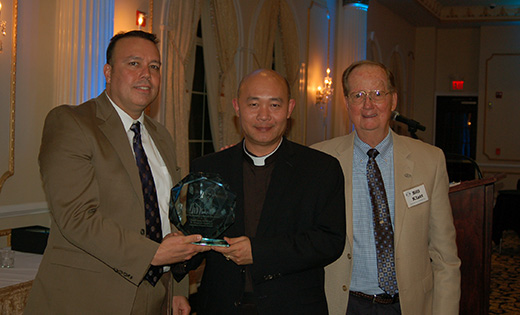 Father Joseph Pham, pastor of Infant Jesus Parish in Woodbury Heights, stands with Rich McDonald, Grand Knight of the church’s Knights of Columbus, and Bill Klatt, part of the leadership team of Good Counsel Homes-South Jersey, with the Father Benedict Groeschel Life Award, presented to Infant Jesus for Outstanding Commitment to Sanctity of Life and support of the home. The parish received the award at Good Counsel Homes-South Jersey’s annual fundraising banquet on Oct. 27.

Photo by Peter G. Sanchez