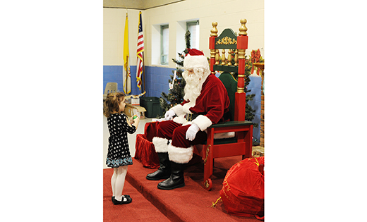 A young girl talks to Santa at the Breakfast with Santa sponsored by the Knights of Columbus Dec. 11 at the parish center at Saint Vincent de Paul Regional School, Mays Landing.

Photo by Alan M. Dumoff
