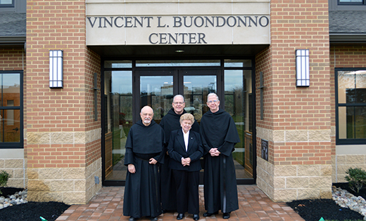 Standing in front of the Vincent L. Buondonno Center at Saint Augustine Prep, Richland, at its grand opening on Dec. 7 are, from left, Father Michael DiGregorio, O.S.A., Father Donald F. Reilly, O.S.A., Rose Davis and Father Robert J. Murray, O.S.A.