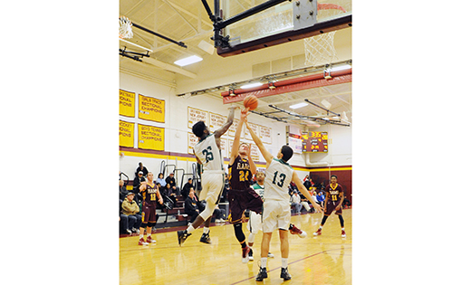 In round-robin play at the Butch McLean Memorial Tournament on Dec. 29, the Camden Catholic boys’ basketball team defeated Gloucester Catholic 55-36 in Haddon Heights.  Above, the Irish’s Dominic Dunn (13) stops the shot of the Rams’ Ben Gerardi.

Photo by Alan M. Dumoff