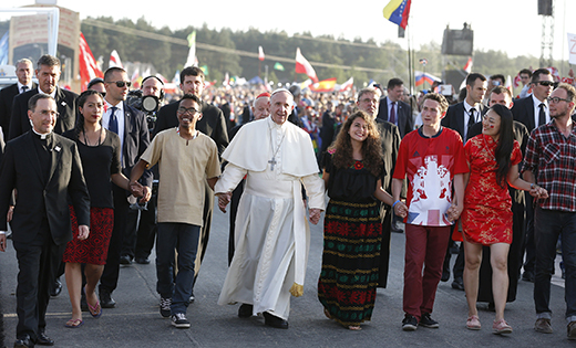 Pope Francis walks with World Youth Day pilgrims as he arrives for a prayer vigil at the Field of Mercy in Krakow, Poland on July 30, 2016. The pope has asked that next year’s 15th Ordinary General Assembly of the Synod of Bishops be prepared to discuss and pray on the theme of “Youth, Faith and Vocational Discernment.”

CNS photo/Paul Haring
