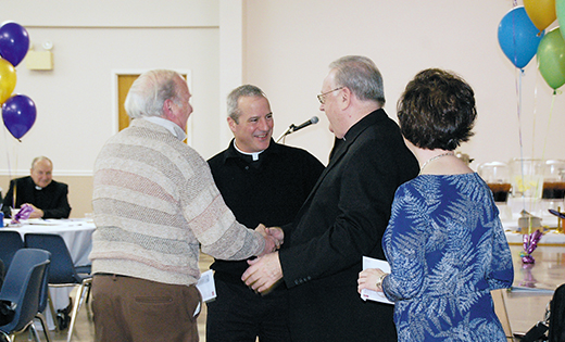 Bishop Dennis Sullivan presents a check to Father E. Joseph Byerley, pastor of Saint Rose of Lima Parish, Haddon Heights, and a parish representative, at the House of Charity Appeal Launch. Once a parish collects its goal amount, it receives a return check for 10 percent of its goal. Parishes have until March 31, 2017 to collect their goal and be eligible for a check. Any amount over goal that is collected, the parish will receive a return check that represents 25 percent of that over goal amount. Bishop Sullivan distributed the first round of checks, totaling $385,326.32, to parishes at the launch, held Jan. 14 at Holy Family Parish, Sewell. Every ministry and program supported by the House of Charity—Bishop’s Annual Appeal was present to answer questions and offer information about programming and services. Outside consultants and members of the Development team also provided workshops with regard to best practices, procedures and overall parish development (below).