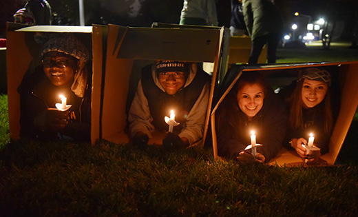 Tahirah Cubbage of Camden, far left, and Madelyn Vassallo of Turnersville, second from right, were among 20 Neumann University students who recently slept outside in cardboard boxes to raise awareness on campus about the issue of homelessness in America.