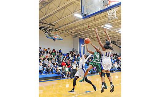In high school girls’ basketball action, Paul VI defeated Camden Catholic, Cherry Hill, 72-56 on Feb. 2 in Haddon Township. Above, Camden Catholic’s Mycala Carney goes up for 2 amidst Paul VI defenders.

Photo by Alan M. Dumoff