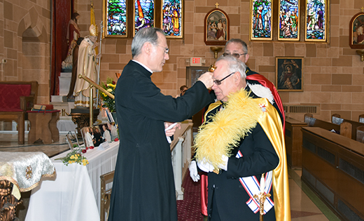 Father Timothy E. Byerley, pastor, blesses Andrew Lipenta, a Fourth Degree Knight of Columbus, with a first class relic of Saint John Paul II on Feb. 20. Saint Peter Parish, Merchantville, had relics of the saint for veneration from Feb. 20-22 and also hosted Father Bronislaw Jakubiec, SDS, who shared memories of his friend, Saint John Paul II.

Photo by James A. McBride