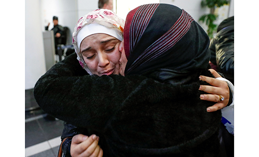 Syrian refugee Baraa Haj Khalaf is greeted by her mother, Fattoum Haj Khalaf, after arriving Feb. 7 at O’Hare International Airport in Chicago.

CNS photo/Kamil Krzaczynski, Reuters