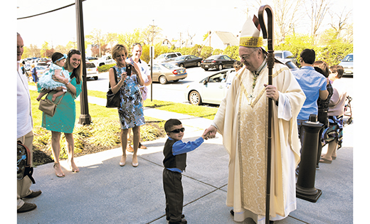Above, 3-year-old Jordan McDowell gives Bishop Dennis Sullivan an Easter greeting after a Sunday Mass at Holy Angels Parish, Woodbury, celebrating Jesus’ resurrection. The Easter liturgy capped off a busy week for Bishop Sullivan that began with Palm Sunday services at Saint Maximilian Kolbe in Marmora on April 9 and continued with the Chrism Mass on Tuesday, April 11, at Our Lady of Hope Parish, Saint Agnes Church, Blackwood; Mass of the Lord’s Supper on Holy Thursday, April 13, at Notre Dame de la Mer, Wildwood; Good Friday services, April 14, at Saint Jude Church, Blackwood; and the celebration of the Easter Vigil, April 15, at Saint Peter, Merchantville.

Photo by James A. McBride