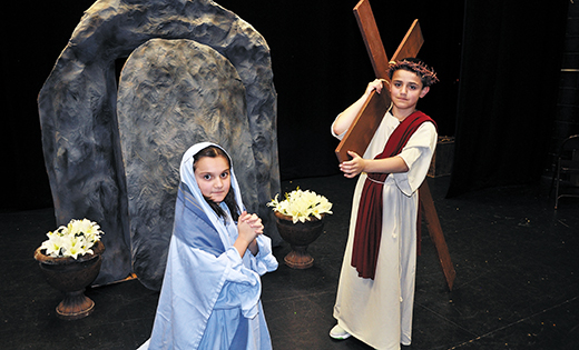 and resurrection. Left, third graders Isabella Elentrio (Mary) and Anthony Gregorio (Jesus) during Saint Mary School, Williamstown’s Live Stations of the Cross. Right, junior Roman soldiers stand at attention at “The Way of the Cross” re-enactment at Ocean City’s Saint Damien Parish.

Photo at right by Alan M. Dumoff