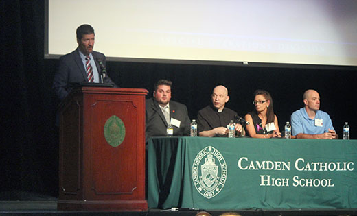Keynote speaker Nicholas Kolen, Assistant Special Agent in Charge of the Drug Enforcement Administration, addresses the audience at Camden Catholic High School, Cherry Hill, with panel members Stephen Smarrito, Father John Stabeno, Wendy Nelson-Beach and Mark Pesotski, as they discuss the crisis of heroin and prescription opioid abuse.

Photo by Mary McCusker