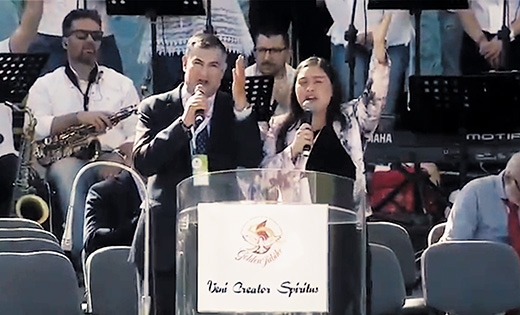 Andrés Arango, Bishop’s Delegate for Hispanic Ministry and Director of Evangelization for the Diocese of Camden, and his wife, Kathia Arango, Director of the Office for Hispanic Catholics of the Archdiocese of Philadelphia, speak in Rome’s Circus Maximus on June 3 during the Pentecost vigil.