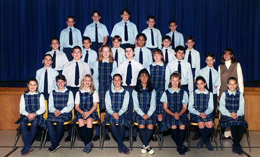 Wearing glasses and standing second row, center, Peter G. Sánchez poses for his 6th grade class photo from his days at Queen of Heaven School, Cherry Hill, with fellow students and teacher, the then-Miss Anzalone.