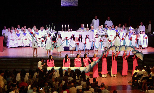 Vietnamese dancers perform in the Adrian Phillips Ballroom of Boardwalk Hall, Atlantic City, during the daylong Wedding of the Sea celebration on the feast of the Assumption, Aug. 15. The annual event celebrates the relationship of the city and the sea and asks God to grant success to those who work to build up the city.

Photo by Mike Walsh