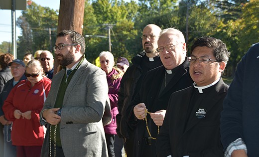Bishop Dennis J. Sullivan prays the rosary to end abortion, with, from left, Michael Jordan Laskey, director, Life and Justice Ministries; Father Michael Goyette, parochial vicar, St. Simon Stock, Berlin and Father Philip Ramos, parochial vicar, The Catholic Community of Christ Our Light, Cherry Hill, in front of the Cherry Hill Women’s Center on Friday, Oct. 27.

Photo by James A. McBride
