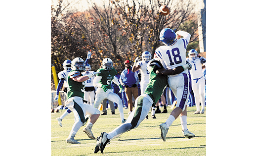 Camden Catholic, Cherry Hill, sent the visiting Paul VI football team home with humble pie on Thanksgiving Day, defeating the Haddonfield school 32-7. At left, Paul VI quarterback John Donegan gets off a pass just before he’s knocked down.

Photo by Alan M. Dumoff