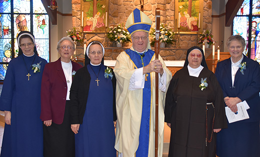 Bishop Dennis Sullivan stands with religious jubilarians after celebrating Mass for World Day for Consecrated Life Feb. 3 at Holy Family Parish, Sewell. Pictured with the bishop, from left, are Sister Maria Wojcik, LSIC, celebrating 50 years; Sister Mary Matthew Labunski, MSBT, 60 years; Sister Bernadetta Pietraszcewska, LSIC, 50 years; Sister Bianca Camilleri, FMIHM, 60 years; and Sister Marguerite MacDonald, IHM, 50 years. Not pictured, Sister Janina Beatrix Wiezcorek, LSIC, 60 years; Sister Patricia A. Bove, OSF, 50 years; and Sister Lucy Klein-Gebbinck, MMS, 25 years.