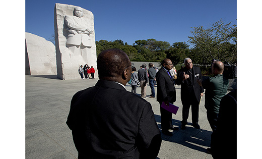 Bishop George V. Murry of Youngstown, Ohio, chair of the U.S. bishops' Ad Hoc Committee Against Racism, center right, conducts an interview near the Martin Luther King Jr. Memorial in Washington, D.C.

(CNS photo/Tyler Orsburn)