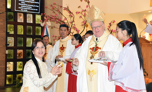 Bishop Dennis Sullivan and the Vietnamese Catholic community in South Jersey came together Feb. 11 at Most Precious Blood Parish, Transfiguration Church to celebrate the Lunar New Year with Mass and a social gathering afterward. With Bishop as he imparts blessings on the congregation in West Collingswood, are visiting priests, Father Joseph Huy Bui (from the Diocese of Xuan Loc, Vietnam) and Father Raymond Tran from Holy Family Congregation in Vietnam. Photo below, Father Joseph An Nguyen, pastor. Not pictured is Father Paul Dinh from the Diocese of Xuan Loc.

Photos by James A. McBride