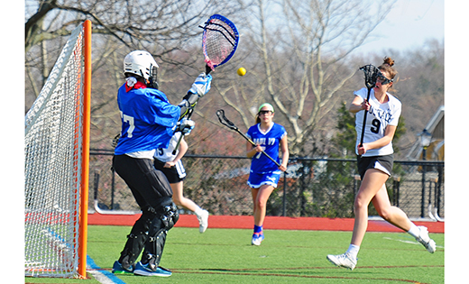 Photo by Alan M. Dumoff
— Veronika O’Donnell of Bishop Eustace (Pennsauken) shoots and scores on Paul VI (Haddonfield) goalie Hailey DeCastro during the two teams’ lacrosse contest on April 9 in Pennsauken. The home team Crusaders downed the visiting Eagles 16-2.