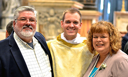 Deacon Joshua Nevitt is pictured with his mother, Sally Fox, and his stepfather, Marshall Fox, at Saint Peter’s Basilica.