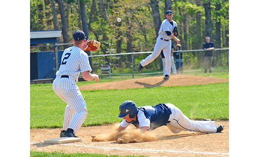 On May 10, visiting Holy Spirit (Absecon) edged out Saint Augustine 1-0 in high school boys’ baseball action, held in Richland. Above, Holy Spirit’s Vince Letizia slides safely back to first after a pickoff attempt.

Photo by Alan M. Dumoff