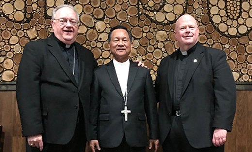 — Bishop Tran Van Toan of Long Xuyen, Vietnam, poses for a photo with Bishop Dennis Sullivan and Father Robert E. Hughes, Vicar General. Bishop Van Toan was visiting Most Precious Blood Parish in West Collingswood to administer the sacrament of confirmation to 37 young people. Bishop Van Toan’s home diocese includes more than 230,000 Catholics and 301 priests.