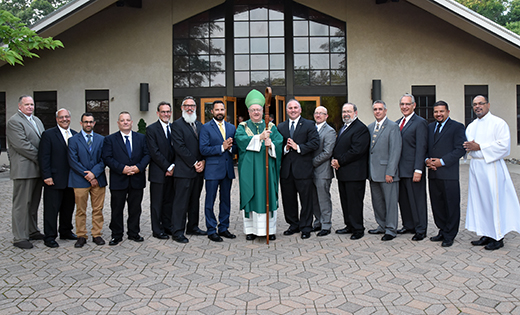 Institution of Lectors and an Acolyte — On May 29 at Saint Mary Church in Cherry Hill, Bishop Dennis Sullivan instituted one deacon candidate to the Ministry of Acolyte and 13 candidates to the Ministry of Reader. Above, the bishop poses for a photo with the group after the ceremony.

Photo by James A. McBride