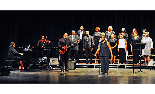 — Father Krzystof Wtorek, administrator of Saint Joseph, Camden, plays guitar with the God’s Men choir and soloists at the New Vision Foundation scholarship awards ceremony and concert June 10 at Rutgers-Camden. Tonya Dorsey, the choir director for Diocese of Camden gospel choir, created and coordinates the event.

Photo by Alan M. Dumoff