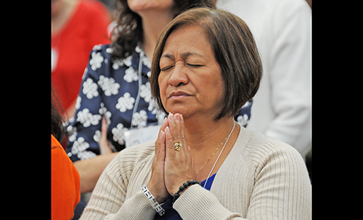 A woman in prayer.