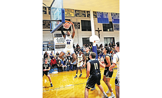 In high school boys’ basketball action on Dec. 14, Wildwood Catholic defeated visiting Holy Spirit (Absecon) 88-68 in Wildwood. Above, the Crusader’s Taj Thweatt goes above and beyond for 2.


Photo by Alan M. Dumoff