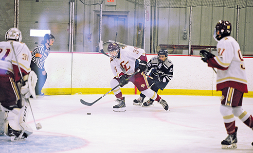 The ice hockey team from Gloucester Catholic defeated Saint Augustine Prep (Richland) 5-2 on Dec. 17 at Holly Dell Arena in Sewell. Above, the Rams’ Matthew Frett skates past the Hermits’ Matthew DeRuchie on his way to the goal.

Photo by Alan M. Dumoff