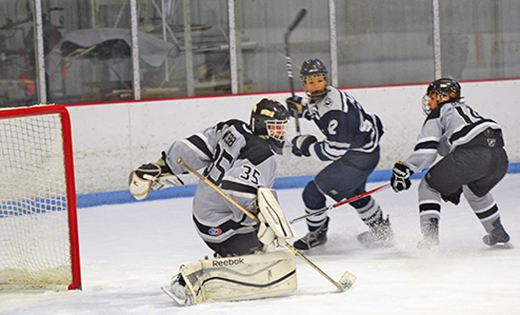 At the Flyers’ Skate Zone in Pennsauken on Dec. 21, the action on the ice was hot as visiting Saint Augustine Prep (Richland) defeated Bishop Eustace Prep (Pennsauken) 4-2. Above, Crusaders’ goalie Ryan Webb tries to prevent a Hermit attack on the net.


Photo by Alan M. Dumoff