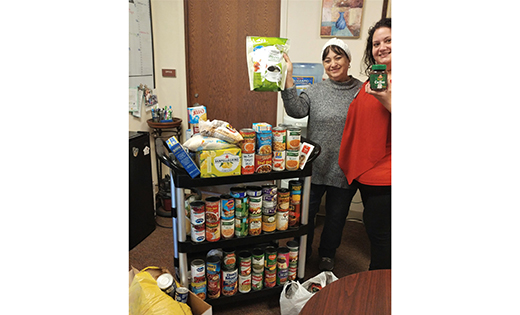 Danielle Duarte, service coordinator, and one of the tenants, Ada Melendez, are among those participating in the food drive at the housing site of the Village at Saint Peter, Pleasantville.