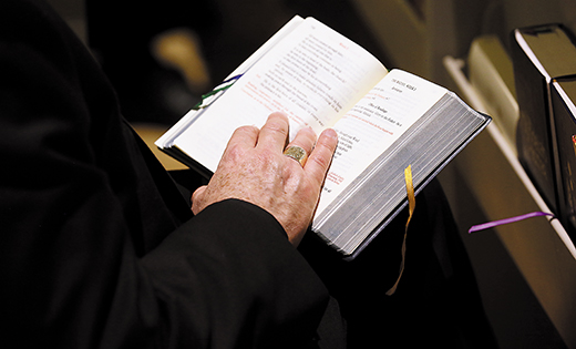 A bishop holds a prayer book during a service in the Chapel of the Immaculate Conception at Mundelein Seminary Jan. 2 at the University of St. Mary of the Lake in Illinois, near Chicago. The U.S. bishops began their Jan. 2-8 retreat at the seminary, suggested by Pope Francis in September, which comes as the bishops work to rebuild trust among the faithful as questions continue to revolve around their handling of clergy sex abuse.


(CNS photo/Bob Roller)