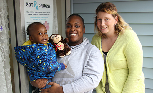 Not long ago, Lauren Segers and her son were homeless, living in her car, but through her own hard work, and the help of Catholic Charities, Segers now has a new job, a home and plans to continue her education. She is pictured with Brittany Thurston, housing stability coordinator for Catholic Charities.

Photo by Mary McCusker