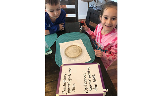 Gianna Petrucci, in kindergarten at Saint Joseph Regional School, Somers Point, does a hands-on experiment to learn about how germs spread. Her brother James, who attends the school’s Pre-K 4 program, benefits from the lesson as well.