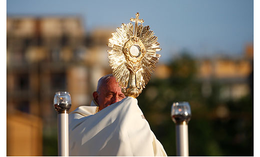 Pope Francis leads Benediction as he marks the feast of Corpus Christi at the end of the Corpus Christi procession through the Casal Bertone neighborhood in Rome June 23, 2019. (CNS photo/Yara Nardi, Reuters)